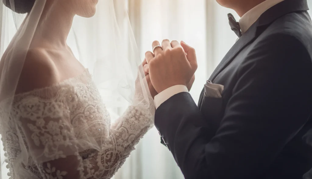 holding-hands-with-wedding-rings-2026-01-08-05-33-57-utc.webp